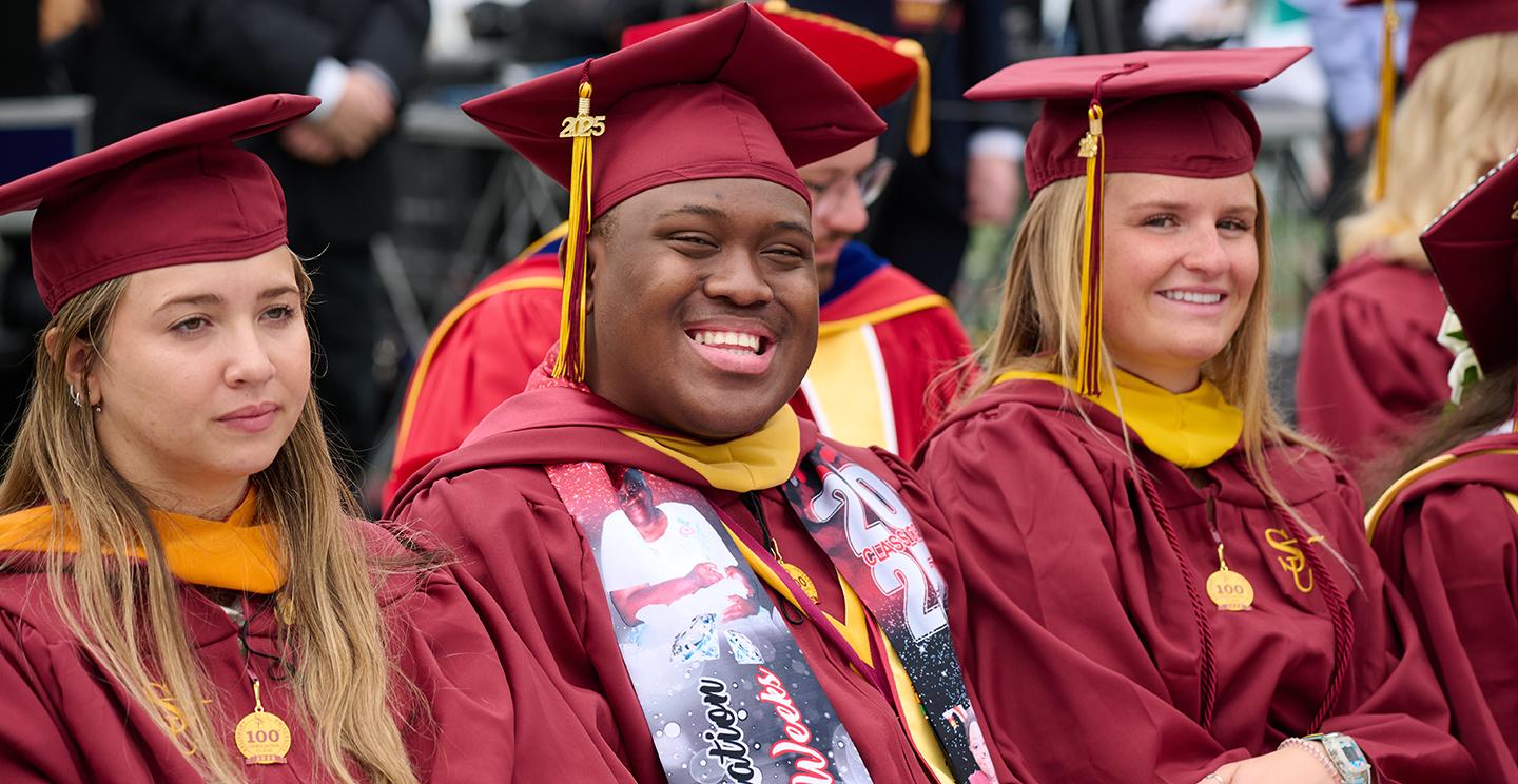 Students smiling at graduation